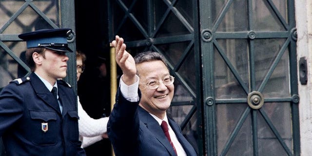 A file picture taken on May 14, 1987 shows French lawyer Jacques Verges waving in front of the law court of Lyon. Verges, who died on August 15, 2013 at the age of 88, was one of the most controversial and feared lawyers recognised by the Paris bar.