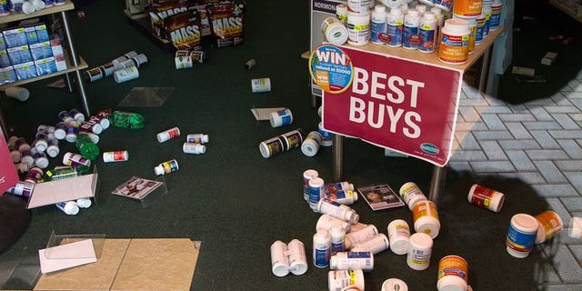 Stock lays on the floor inside a retail store in Wellington on July 22, 2013, following an earthquake a day earlier. There have been hundreds of aftershocks since the July quake.