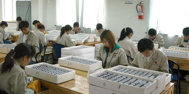 Workers assemble lighters at the Rifeng factory in Wenzhou, China's Zhejiang province in 2006. A former vice mayor of China's eastern city of Wenzhou was Friday sentenced to three years in jail for abuse of power in a land deal, state media reported.
