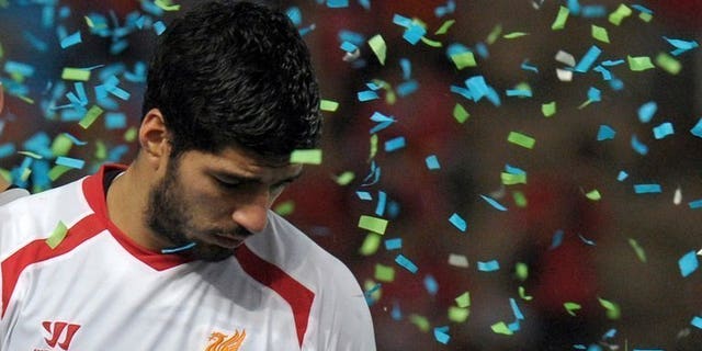 Liverpool's Luis Suarez reacts after the match against Thailand at the Rajamangala National Stadium in Bangkok, on July 28, 2013. Suarez has returned to first-team training, according to British media reports.