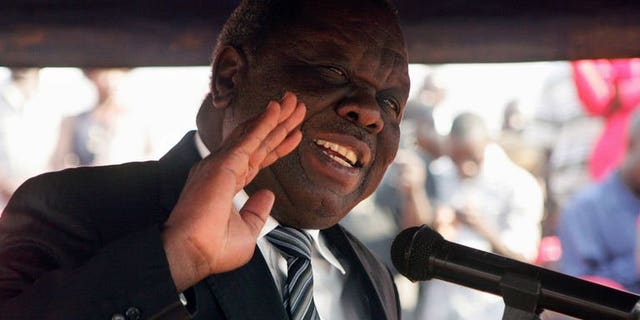 Movement for Democratic Change (MDC) Zimbabwe opposition leader, Morgan Tsvangirai, addresses mourners during the burial of Rebecca Mafikeni, a party activist of the MDC on August 14, 2013 in Harare. Tsvangirai on Friday withdrew a legal challenge against the outcome of last month's disputed election, his MDC party said, claiming the legal process would not be fair.