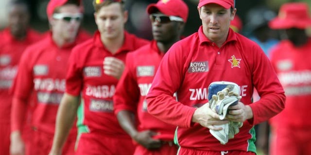 Zimbabwe's captain Brendan Taylor leaves the field with teammates at Queens Sports Club on August 3, 2013 in Harare. Zimbabwe's cricketers have returned to training after a brief stand-off with Zimbabwe Cricket over unpaid wages and the value of future contracts, ensuring that Pakistan's tour of the country will go ahead as planned.