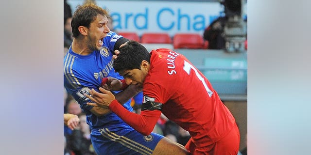 Branislav Ivanovic (left) recoils after being bitten by Luis Suarez at Anfield on April 21. Unsettled Liverpool striker Luis Suarez made his return to Anfield on Saturday, saluting fans from beside the pitch prior to his side's opening Premier League game against Stoke City.