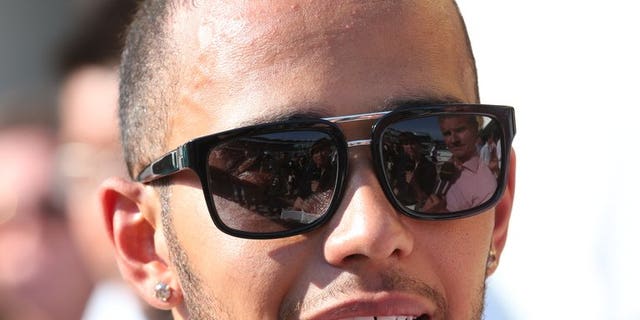 Lewis Hamilton speaks to the press at the Hungaroring circuit in Budapest on July 28. Mercedes team chief Ross Brawn believes that Hungarian Grand Prix winner Hamilton still has much more to offer to the team despite his recent surge of excellent form.