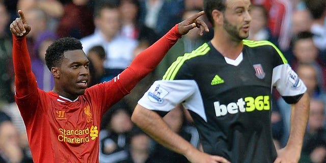 Daniel Sturridge (left) celebrates scoring the first Premier League goal of the season at Anfield on Saturday. Sturridge had the honour of scoring the first goal of the new Premier League season on Saturday when he put Liverpool ahead against Stoke City.