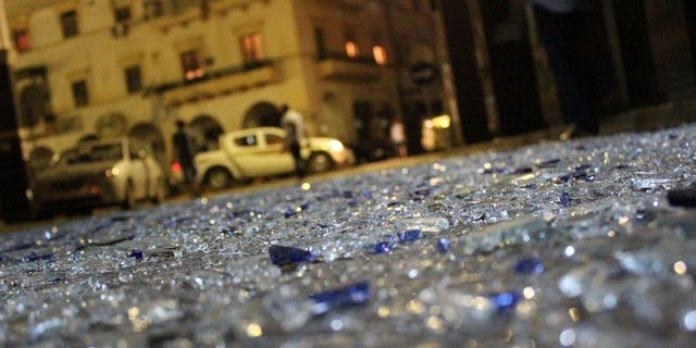 Pieces of glass litter the street in Benghazi on July 28, 2013 after two powerful explosions. A bomb exploded Saturday in front of Egypt's consulate in the eastern Libyan city of Benghazi, causing some damage to the building but no casualties, a security official said.