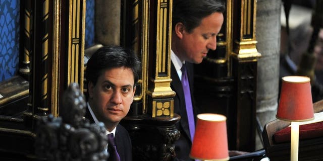Prime Minister David Cameron (R) and Labour Party leader Ed Miliband attend a service at Westminster Abbey in London on June 4, 2013. Miliband has suffered a summer ratings slump, a poll out Sunday showed.