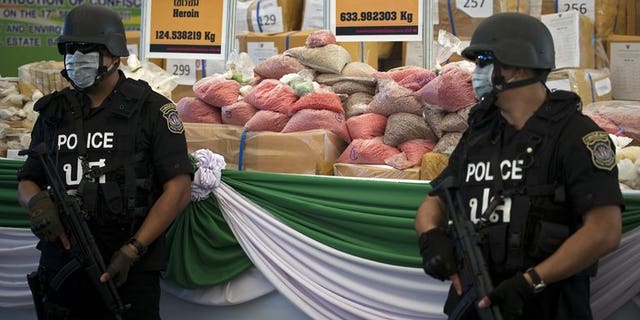 Illustration: Thai police guard bags of methamphetamine pills seized on September 17, 2011. The authorities have seized another 980,000 of the pills, worth $6 million.