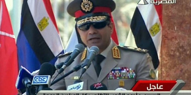 An image grab taken from Egyptian state TV shows Egypt's army chief General Abdel Fattah al-Sisi giving a live broadcast calling for public rallies to give him a mandate to fight "terrorism and violence". Egypt's army chief vowed Sunday to stand firm in the face of violence by Islamists, in his first remarks since a deadly crackdown on supporters of ousted president Mohamed Morsi.