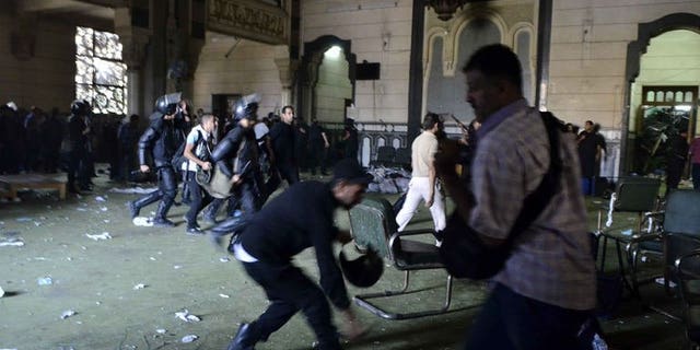 Egyptian riot policemen in Cairo's Al-Fath mosque where Islamist supporters of ousted Morsi holed up on August 17, 2013. Egyptian policemen fired tear gas at Islamist inmates who rioted and tried to escape during their transfer to a prison on Cairo's outskirts on Sunday, officials said.