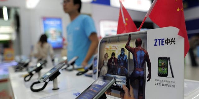 Mobile devices are displayed on a ZTE sales counter in Wuhan, central China's Hubei province on October 8, 2012. Ethiopia signed an $800-million (600-million-euro) agreement with Chinese telecom giant ZTE Sunday to expand its telecommunications network, national operator Ethio Telecom said.
