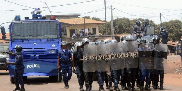 Guinea's police forces prepare to disperse a demonstration in Conakry on May 2, 2013. A radio station in the east of Guinea was ransacked by pro-government demonstrators for reporting on protests against President Alpha Conde, employees told AFP.