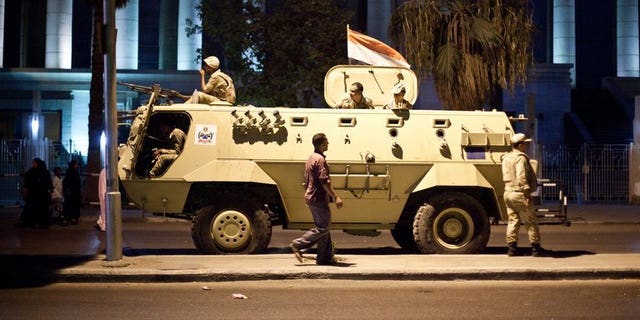 An Egyptian army armoured vehicle pictured in front of the Supreme Constitutional Court in Cairo ahead of planned demonstrations on August 18, 2013. Israel and the West must support Egypt's army, an Israeli official said Monday, after 24 Egyptian policemen were killed in an attack in the Sinai bordering the Jewish state.