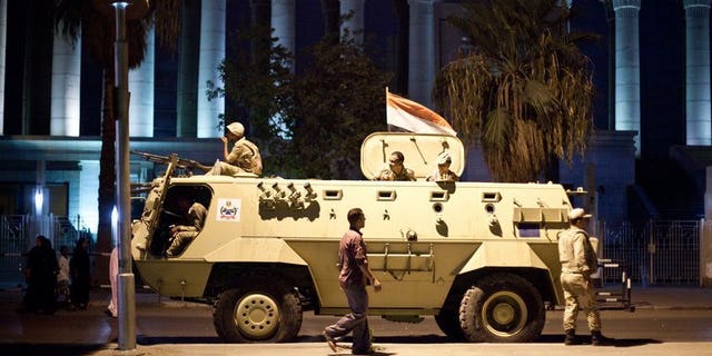 An Egyptian army armoured vehicle pictured in front of the Supreme Constitutional Court in Cairo ahead of planned demonstrations on August 18, 2013. Israel and the West must support Egypt's army, an Israeli official said Monday, after 24 Egyptian policemen were killed in an attack in the Sinai bordering the Jewish state.