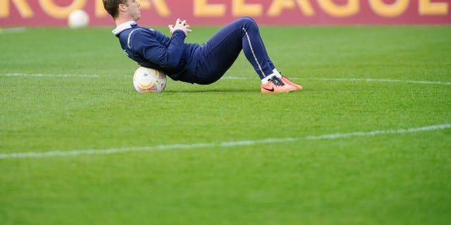 Scott Parker stretches during a training session at the Saint Jakok stadium in Basel on April 10, 2013. Fulham signed England midfielder Parker from Tottenham for an undisclosed fee on Monday.