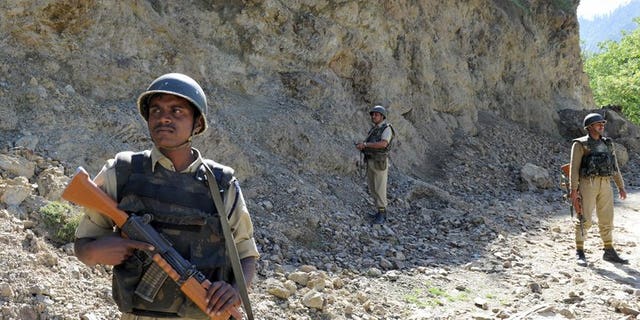 Indian security forces stand guard near the Line of Control (LOC) on May 13, 2009. India's army will take "all possible steps" to counter any ceasefire violations by Pakistan along the border between the countries, the Indian defence minister said Monday, warning not to take New Delhi's restraint for granted.