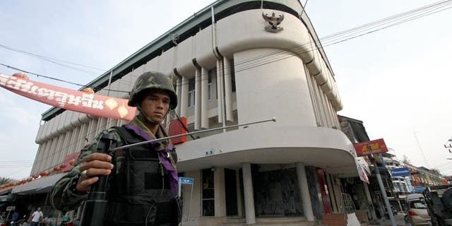 This picture taken on March 2, 2010 shows a Thai soldier using a GT200 detector as he patrols the streets of Yala, in Thailand's restive south. A British businessman who sold fake bomb detectors worldwide was jailed for seven years on Tuesday, with his judge branding the devices "useless".