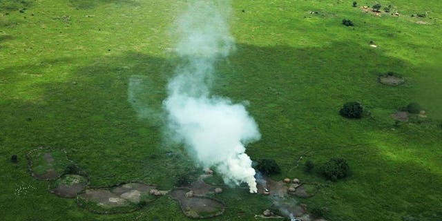 Houses burnt by cattle raiders in a village in Pibor County, in South Sudan's Jonglei state, emit plumes of smoke on July 12, 2013. A top army commander in the troubled new nation of South Sudan has been arrested over a string of alleged human rights violations, officials said Tuesday.