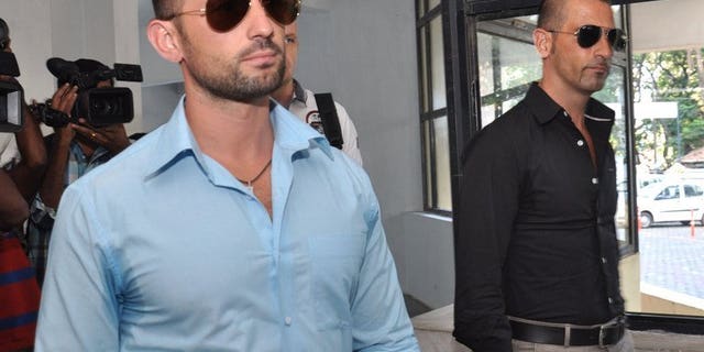 Italian marines Massimiliano Latorre (R) and Salvatore Girone come out from the police commissioners office in Kochi on December 20, 2012. Four Italian marines summoned to give evidence in the trial of Latore and Girone over the shooting deaths of two Indian fishermen have refused to travel to the country, a report said Tuesday.