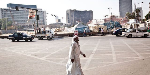 An Egyptian man walks in Tahrir Square, after it has been partially reopened to traffic, on August 20, 2013 in Cairo. European Union foreign policy chief Catherine Ashton said Tuesday that she had offered to return to Cairo to help facilitate a way out of the country's crisis.
