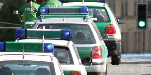 A convoy of police cars in Berlin on June 2, 2006. At least three people were killed and five others wounded Tuesday when a man opened fire in a restaurant in a small village in southern Germany, police said.