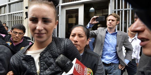 Irish citizen Michaella McCollum Connolly, 20, is escorted out of the Callao prosecutor's building on August 20, 2013, to be taken to the district court with her British companion Melisa Reid. The pair were arrested at Lima airport as they tried to board a flight to Spain carrying what Peruvian police said was 11 kilos of cocaine.