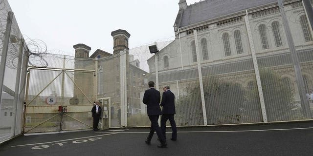 Prime Minister David Cameron visits Wormwood Scrubs Prison in west London last October. A triple murderer is appealing to the European Court of Human Rights to challenge his "life means life" sentence, the first Briton to do so.