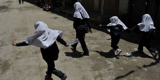 Afghan schoolgirls in Istalif, north of Kabul, on May 29, 2012. The education chief of an Indonesian city sparked outrage Wednesday after proposing that teenage schoolgirls should undergo virginity tests to enter senior high school.