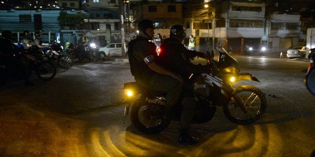 Members of the National Guard carry out a security operation in the impoverished Petare neighbourhood, one of Caracas' most dangerous slums, on May 13, 2013. Venezuela is installing 30,000 surveillance cameras to crack down on rampant crime, officials said Wednesday.