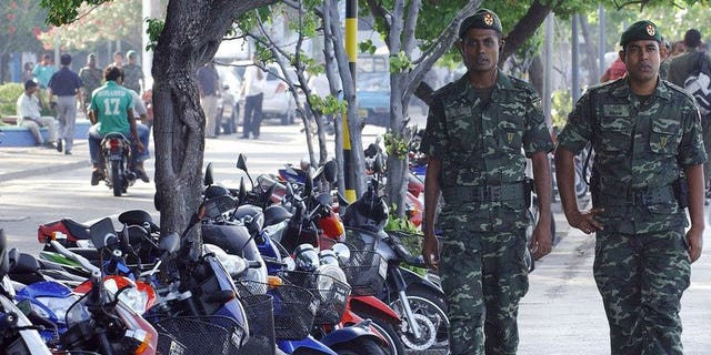 File photo of Maldivian security personel on patrol in Male. The Maldivian High Court has overturned a public flogging sentence for a 15-year-old rape victim whose conviction sparked outrage among rights groups and focused attention on the island nation treatment of women.