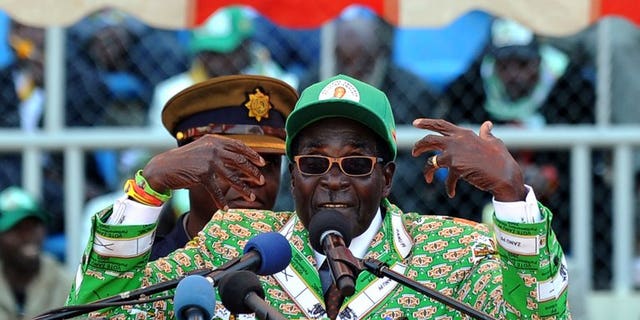 Zimbabwe's President Robert Mugabe addresses at a rally in Harare on July 28, 2013. Veteran leader Robert Mugabe was sworn in as Zimbabwe's president for another five-year term before a stadium packed with thousands of jubilant supporters Thursday. Mugabe, 89, pledged "to observe, uphold and defend the constitution of Zimbabwe" in an oath administered by Chief Justice Godfrey Chidyausiku.