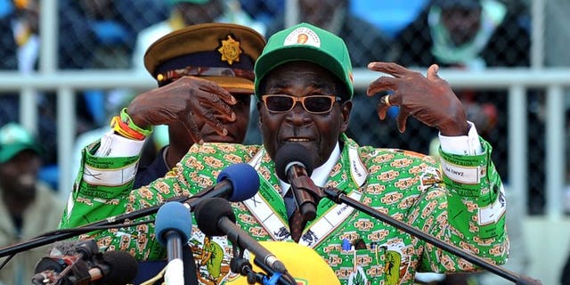 Zimbabwe's President Robert Mugabe addresses at a rally in Harare on July 28, 2013. Veteran leader Robert Mugabe was sworn in as Zimbabwe's president for another five-year term before a stadium packed with thousands of jubilant supporters Thursday. Mugabe, 89, pledged "to observe, uphold and defend the constitution of Zimbabwe" in an oath administered by Chief Justice Godfrey Chidyausiku.