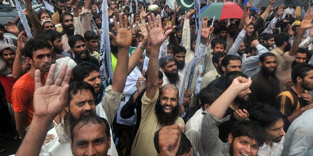 Supporters of Pakistan's outlawed Islamic hardline group Jamaat ud Dawa shout slogans during an anti-Indian protest rally in Lahore on August 14, 2013. Pakistan accused Indian troops Thursday of killing a soldier in disputed Kashmir, the latest in a series of reported clashes which have raised tensions between the nuclear-armed neighbours.