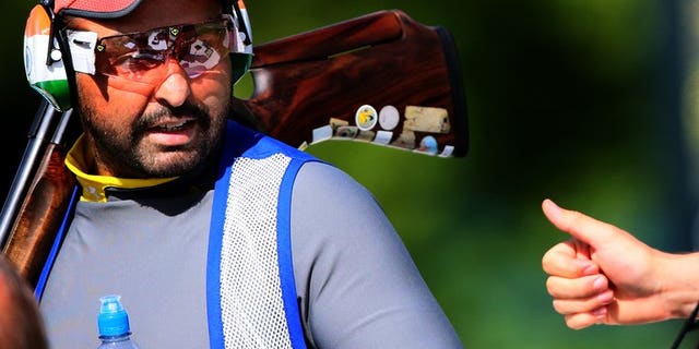 Ronjan Sodhi receives a thumbs-up from a fellow competitor during the men's Double Trap qualification of the shooting event of the London Olympic Games, at the Royal Artillery Barracks, on August 2, 2012. Sodhi, a double-trap world record holder in 2010 and 2011, has been named winner of India's highest sports award.