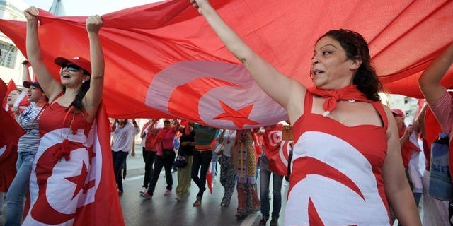 Demonstrators shout slogans during a protest in Tunis on August 13 against the country's Islamist-led government . Tunisia's opposition coalition on Friday rejected proposals by the ruling Islamists for ending a month-long political crisis, saying its offer to enter talks on a government of technocrats was insufficient.