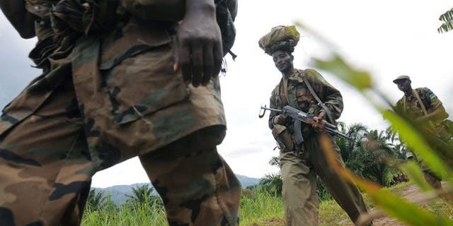 Rwandan Defence Force soliders on February 05, 2009 in Pinga, 150kms north west of Goma. Rwanda's army has warned neighbouring Democratic Republic of Congo, who it accuses of deliberate bombing over the border, that it will not stand by "indefinitely", in a statement late Friday.