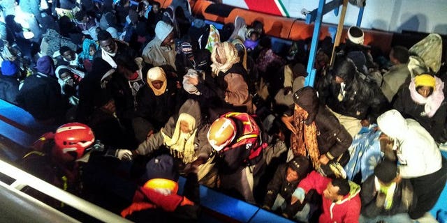 A handout photo provided on December 15, 2012 by the Italian Coast Guard press office shows a boat carrying 218 sub-Saharan migrants near the island of Lampedusa on December 14. The Italian coast guard said Saturday it had rescued more than 200 migrants off Sicily, swelling the ranks of the thousands of boat people who have made the crossing thanks to calm summer waters.