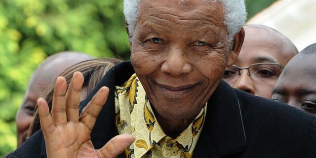South African former President Nelson Mandela waves as he arrives at a polling station in Johannesburg on April 22, 2009. Mandela is "unstable" at times but has shown "great resilience" as he remains in a critical condition in hospital, South Africa's presidency said Saturday.