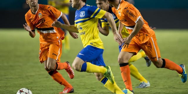 Everton's Leighton Baines tries to get past the Valencia defense during a 2013 International Champions Cup on August 6, 2013, Florida. Manchester United manager David Moyes says former club Everton will harm the careers of Baines and Marouane Fellaini if they prevent the pair from following him to Old Trafford.