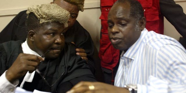 Lawyer Mike Ozekhome (L) chats with client Diepreye Alamieyesiegha on December 20, 2005, in Lagos. Gunmen have kidnapped the prominent lawyer and social critic in southern Nigeria in an apparent ransom bid, a colleague and police said Saturday.