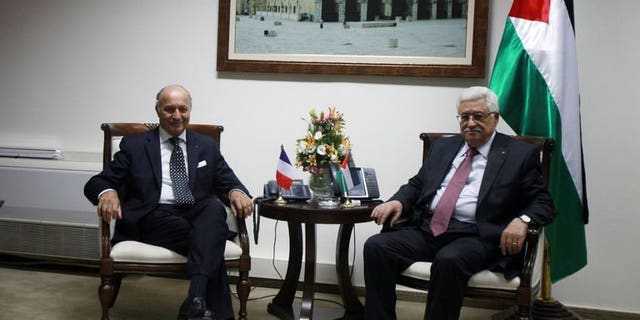 French Foreign Minister Laurent Fabius meets with Palestinian President Mahmud Abbas (R) on August 24, 2013 in the West Bank city of Ramallah. A successful outcome to the US-brokered negotiations between Israel and the Palestinians would be like a "thunderbolt" for peace in the crisis-ridden Middle East, French Foreign Minister Laurent Fabius said Saturday.