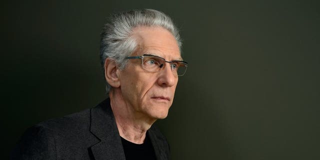 Director David Cronenberg poses at the Guess Portrait Studio during the 2013 Toronto International Film Festival on September 5, 2013 in Toronto, Canada. Life, not his films, is "weird and strange," Cronenberg said as the Toronto film festival announced a retrospective of his cold, clinical, and often gory movies.