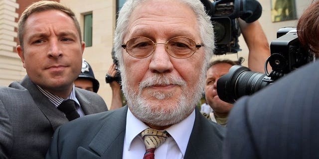 Dave Lee Travis leaves Westminster Magistrates Court in central London on August 23, 2013. The radio presenter is due to appear at crown court later charged with committing 11 indecent assaults and one sexual assault.