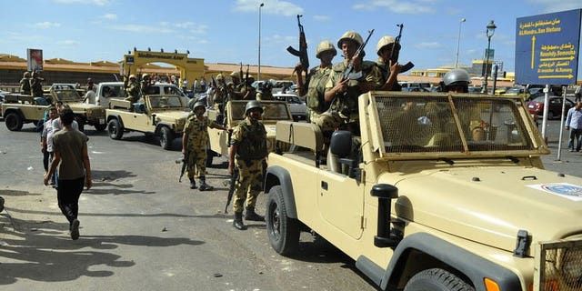 Egyptian soldiers are deployed in the streets of the Sidi Gaber neighbourhood of the northern city of Alexandria, on September 6, 2013. Thousands of supporters of ousted Egyptian president Mohamed Morsi have turned out for protests in Cairo after Friday prayers, despite a sustained crackdown on Islamists by the country's new authorities.