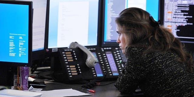 A broker monitors market movements at BGC Partners in London, on August 5, 2011. London shares closed lower as sentiment was hit by fresh fears over Syria and the possible withdrawal of US Federal Reserve stimulus.