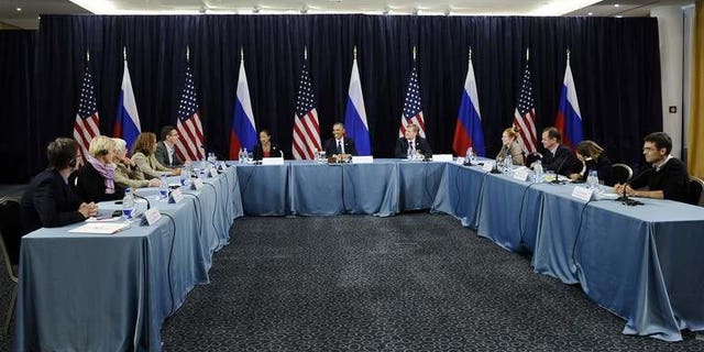 US President Barack Obama (C) holds a Civil Society Roundtable with gay, lesbian, transexual right activists at the Crowne Plaza Hotel in Saint Petersburg on September 6, 2013.