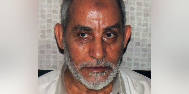 Muslim Brotherhood leader Mohamed Badie shortly after his arrest in Cairo, on August 20, 2013. Egypt's state prosecutor has said Badie will stand trial in a second case over clashes in which several demonstrators were killed, according to judicial sources.