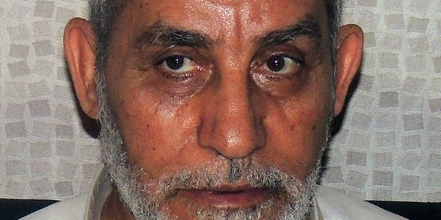 Muslim Brotherhood leader Mohamed Badie shortly after his arrest in Cairo, on August 20, 2013. Egypt's state prosecutor has said Badie will stand trial in a second case over clashes in which several demonstrators were killed, according to judicial sources.