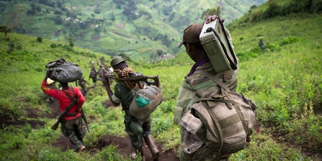 M23 rebels leave the village of Karuba, eastern DR Congo, on November 30, 2012. The rebeles say they are waiting for a government delegation to arrive to resume peace talks, in line with an ultimatum set by regional leaders.