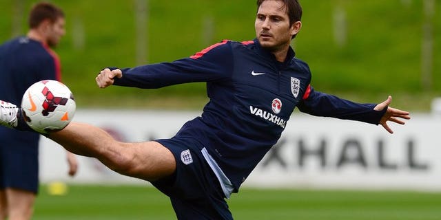 England midfielder Frank Lampard kicks the ball in Burton-on-Trent, central England, on September 3, 2013.